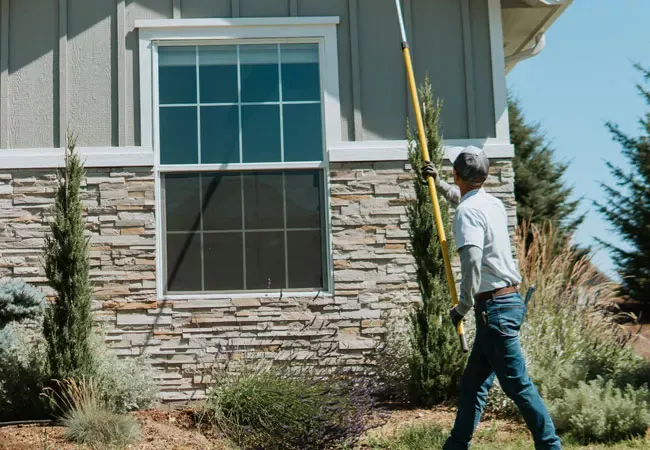 Tech sweeping home exterior