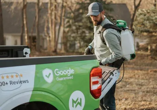 Tech getting equipment out of truck
